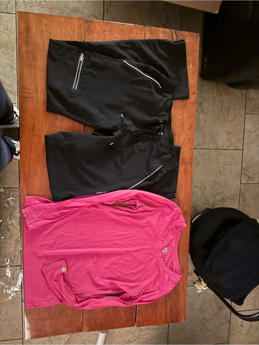 healing hands Pink Crew Neck Active Top underscrub and black scrub bottoms